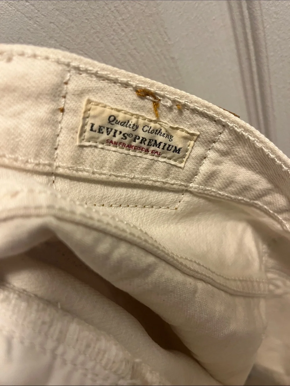 Levi's Cream Distressed Denim Cutoff Shorts